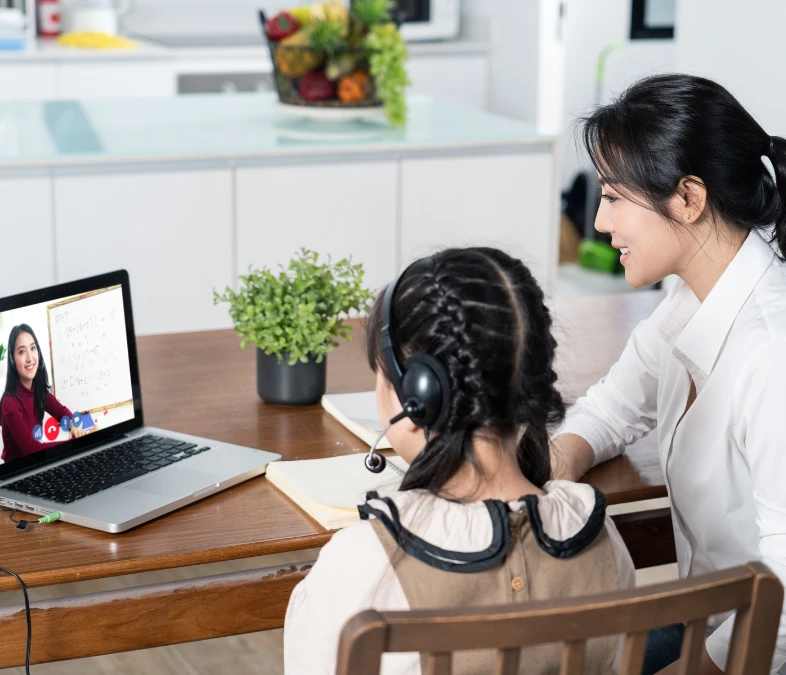 Child using tablet for online education and therapy session