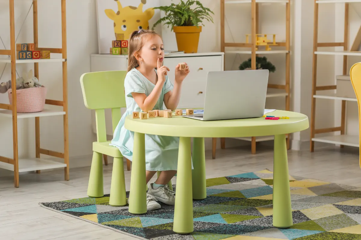 Child practicing pronunciation during virtual speech therapy