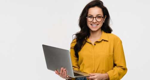 a professional woman holding a laptop.